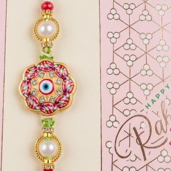 Meenakari Bloom Rakhi - Floral evil eye Rakhi with pearl rings and crystals